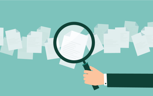 Symbolized by a hand holding a magnifying glass over documents, Intelligent Document Processing offers us unprecedented control and scrutiny over our documents like never before.